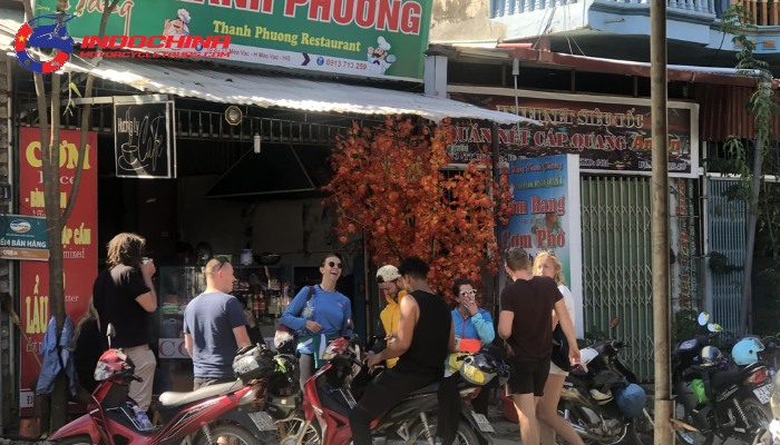 Front view of Thanh Phuong Restaurant with motorbikes and customers